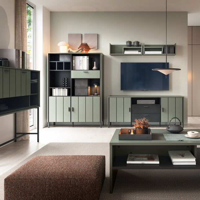 Two-door cabinet with a drawer, featuring a sleek green finish and black accents, paired with a matching wall shelf