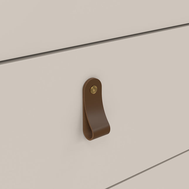 Brown leather handle with brass stud on a smooth, light-coloured drawer front