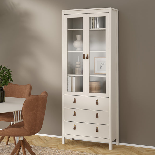 Tall cabinet with glass doors, three drawers, and wooden handles, finished in a soft cream colour