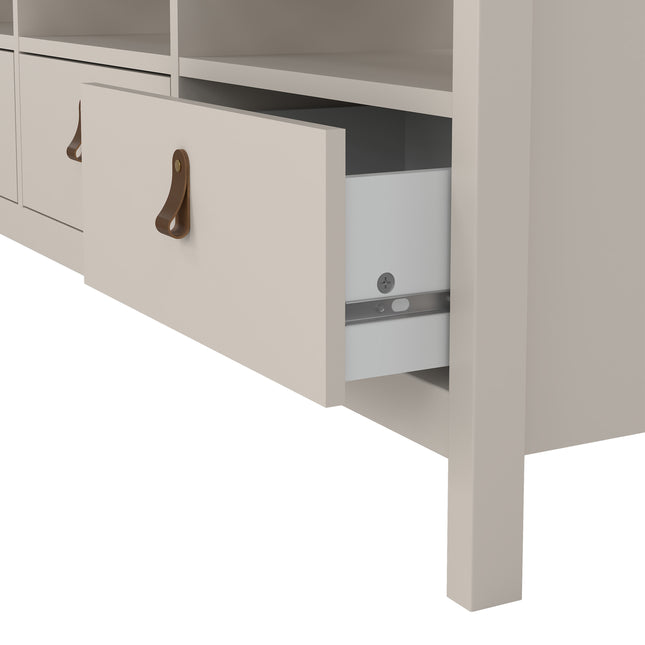 TV unit featuring a single open drawer with a white interior and a brown leather handle, set against a light-coloured frame