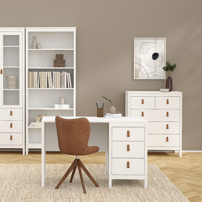 White chest of drawers with two small and three larger drawers, featuring brown leather handles, set against a neutral wall