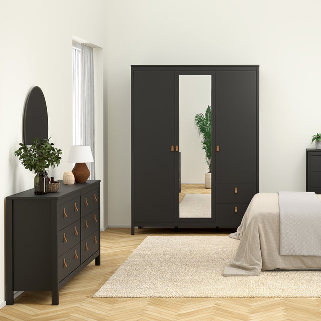 Double dresser with four large drawers and leather pull handles, finished in dark grey, placed beside a mirror and lamp