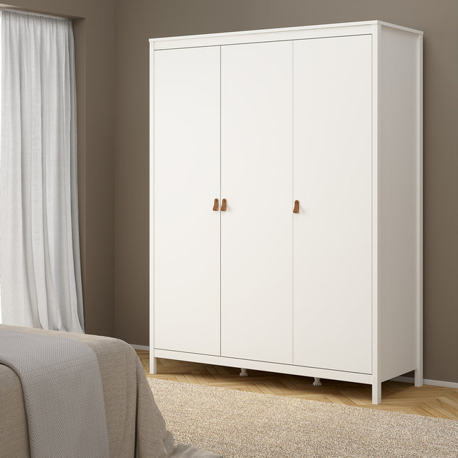 Three-door wardrobe in white with wooden handles and tapered legs, set against a neutral wall and carpeted floor