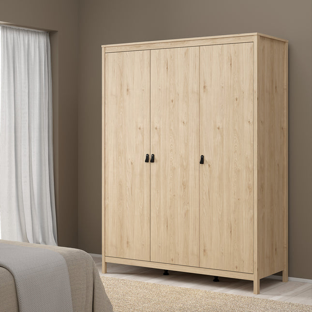 Wardrobe with three doors, featuring a light wood finish and black handles, set against a neutral wall