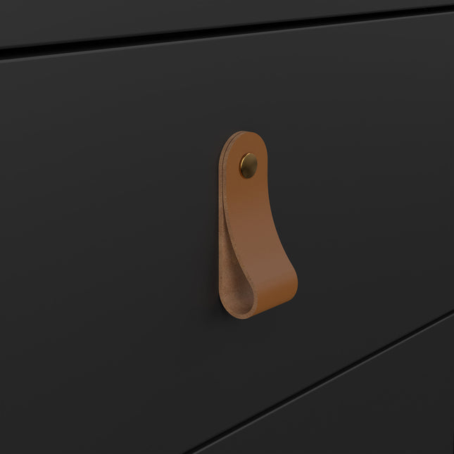 Leather handle in tan with a brass button, attached to a smooth black drawer front