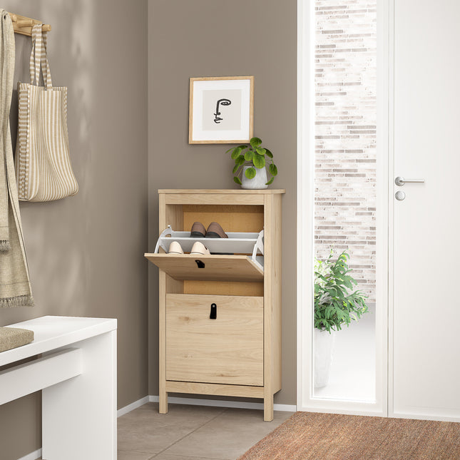 Tall shoe cabinet with two flap doors, light wood finish, featuring a lower compartment and a small handle