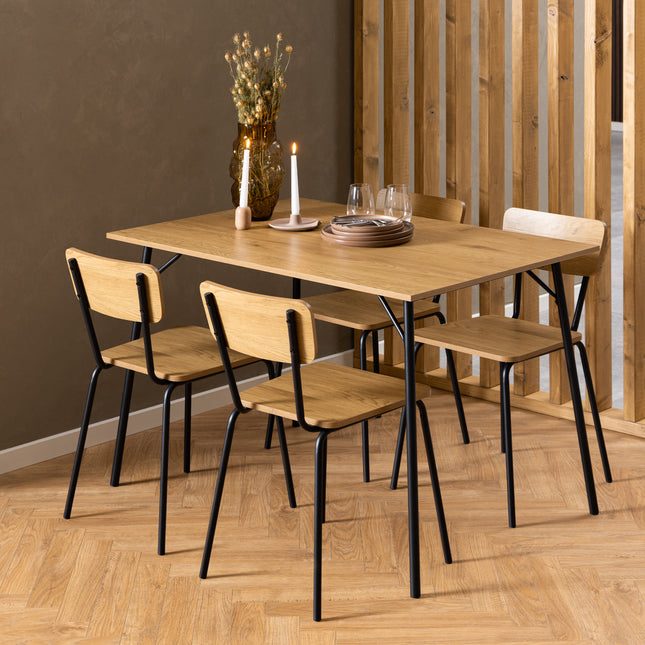 Rectangular dining table with a smooth wooden surface and black metal legs, accompanied by four wooden chairs with curved