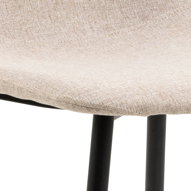 Curved seat with textured beige fabric and black metal legs