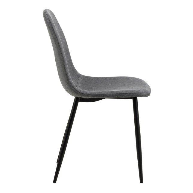 Side view of a dining chair with a curved backrest and a padded seat, featuring slender black metal legs and grey fabric
