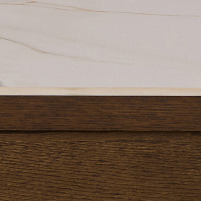 Rectangular dining table with a smooth cream ceramic top and a wooden base in a warm brown finish