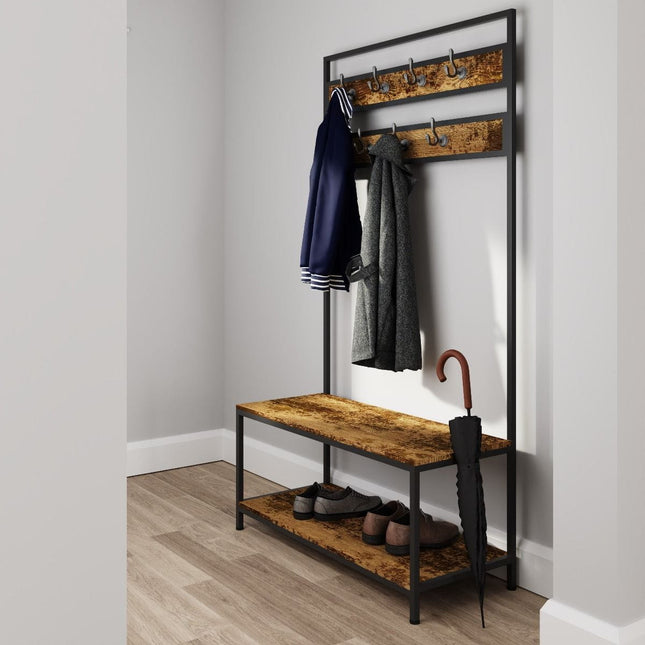 Coat rack with two wooden shelves, metal frame, and hooks for hanging coats, set against a light grey wall