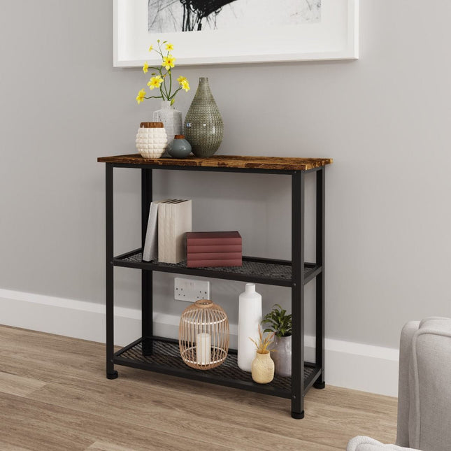 Console table with a wooden top and black metal frame, featuring two shelves and decorative items like vases and a plant