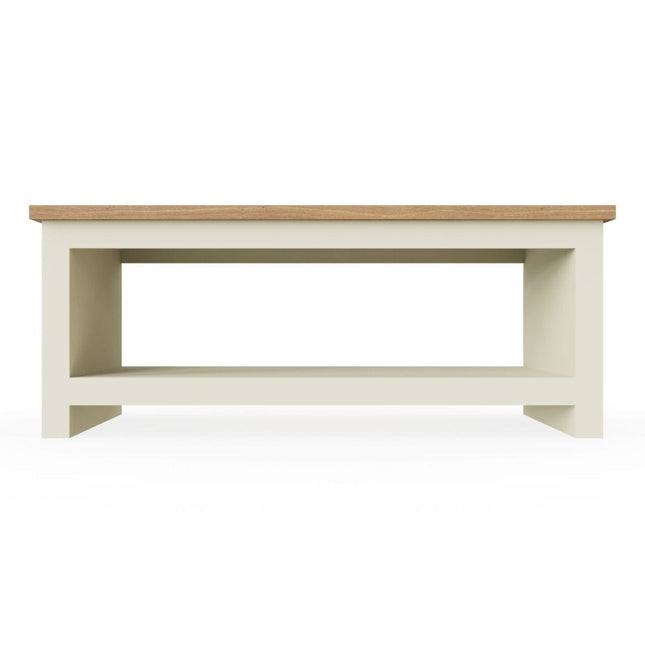 Rectangular coffee table with a light wood top and a cream-coloured base featuring an open shelf underneath