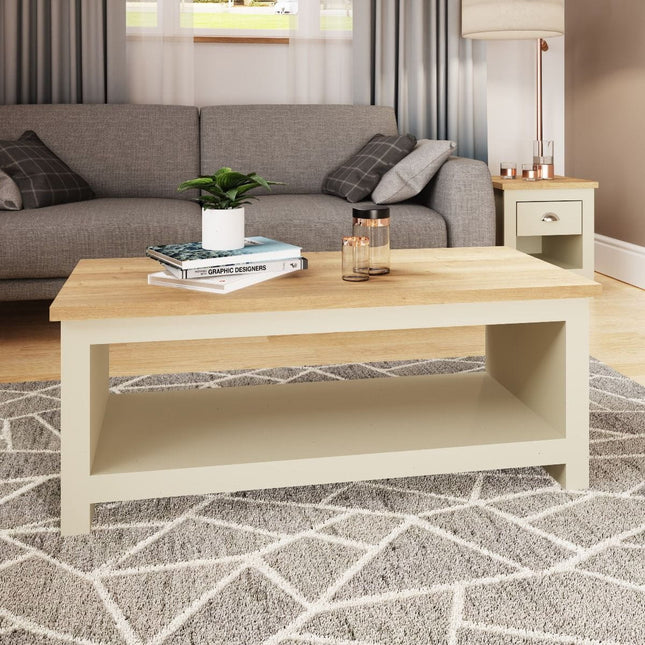 Rectangular coffee table with a light wood top and a pale grey base, featuring an open shelf underneath