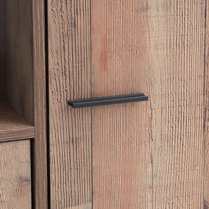 Close-up of a rustic oak cabinet door featuring a textured wood grain and a sleek black handle