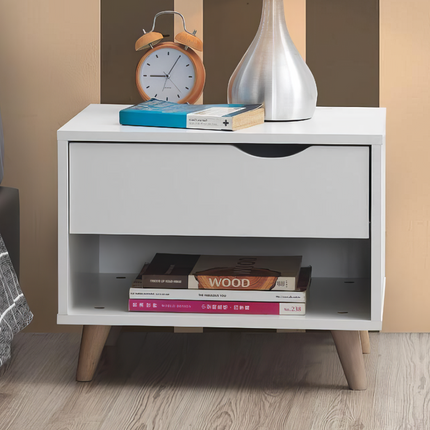 Bedside table with one drawer and open shelf, finished in white with wooden legs, featuring a curved drawer handle