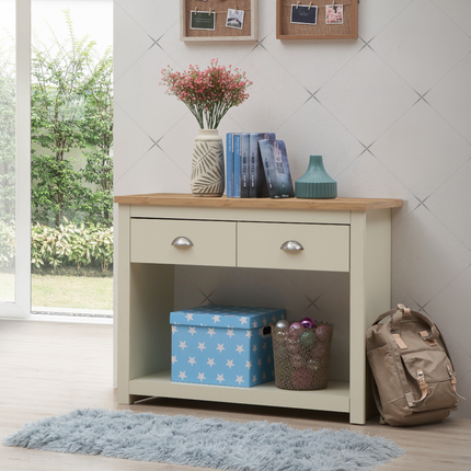 Console table with two drawers and a light grey base, featuring a wooden top, placed against a wall with decorative items