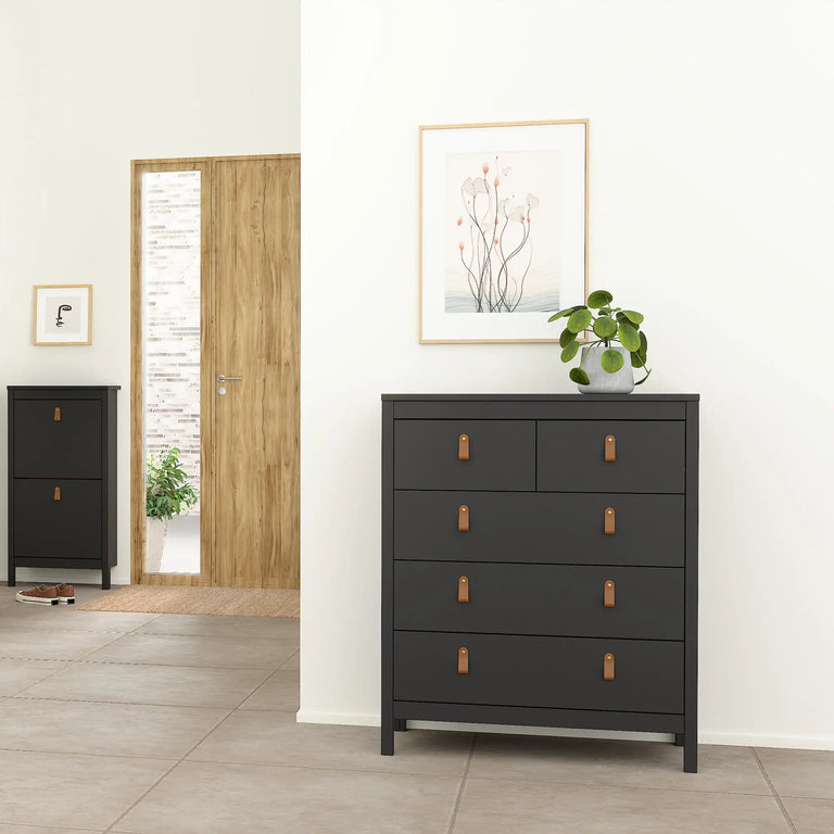 Chest of drawers with three large and two small drawers, finished in black with leather strap handles