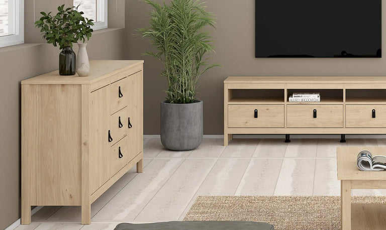 Light wood-finished sideboard with three drawers and black metal handles