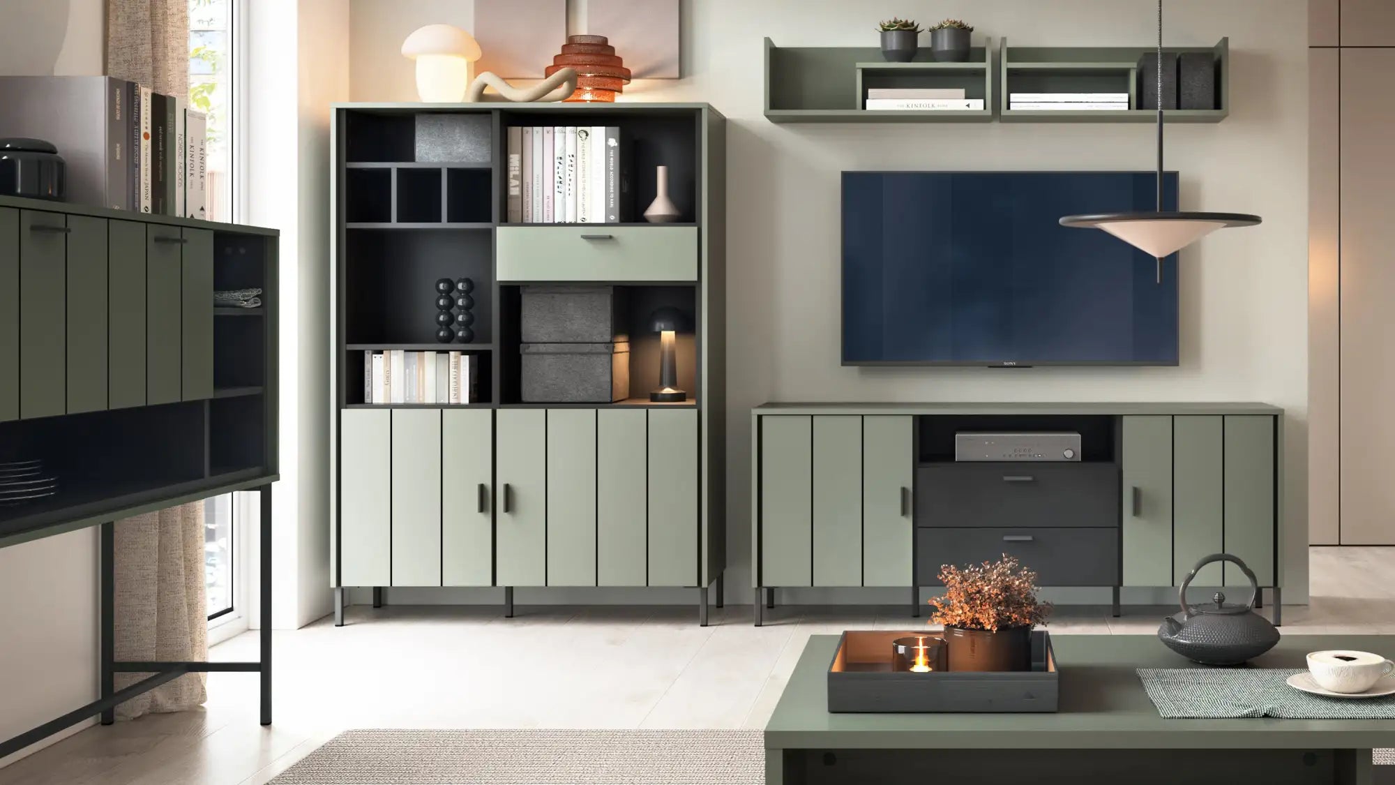 Modern olive green modular bookshelf with black and gray accents, sleek vertical paneling, and minimalist design.