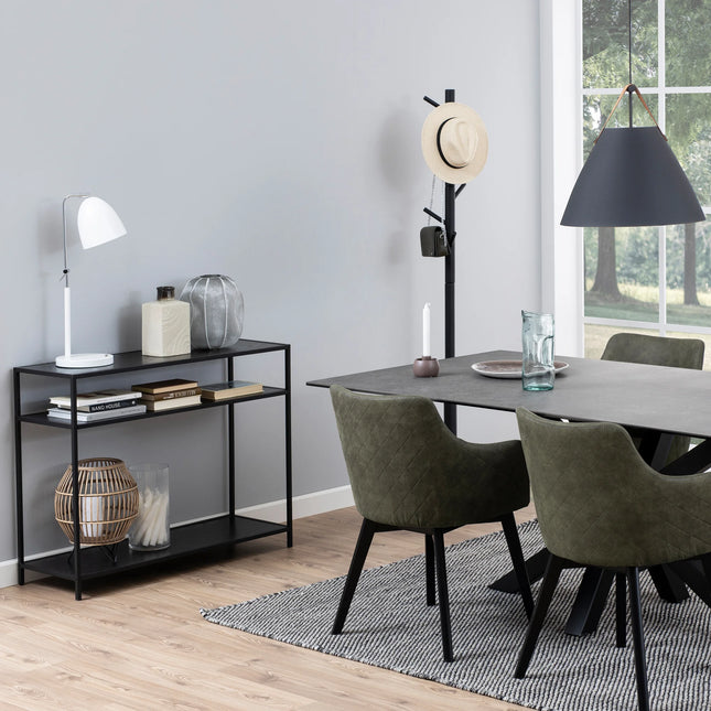 Seaford console table in matte black with two open shelves, styled with books and decor