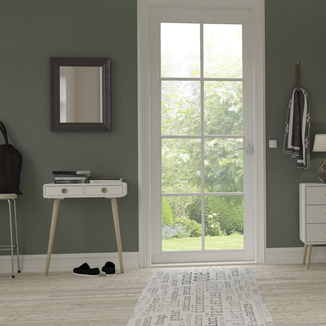 Softline low hall table with white drawer top and tapered light wood legs, books stacked on top