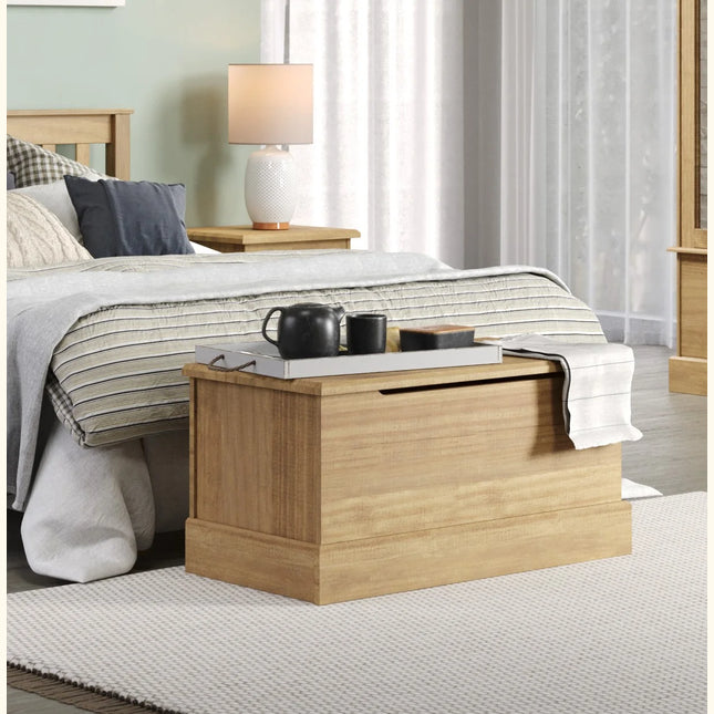 Cotswold storage trunk in antique waxed pine with recessed lid grip and plinth base