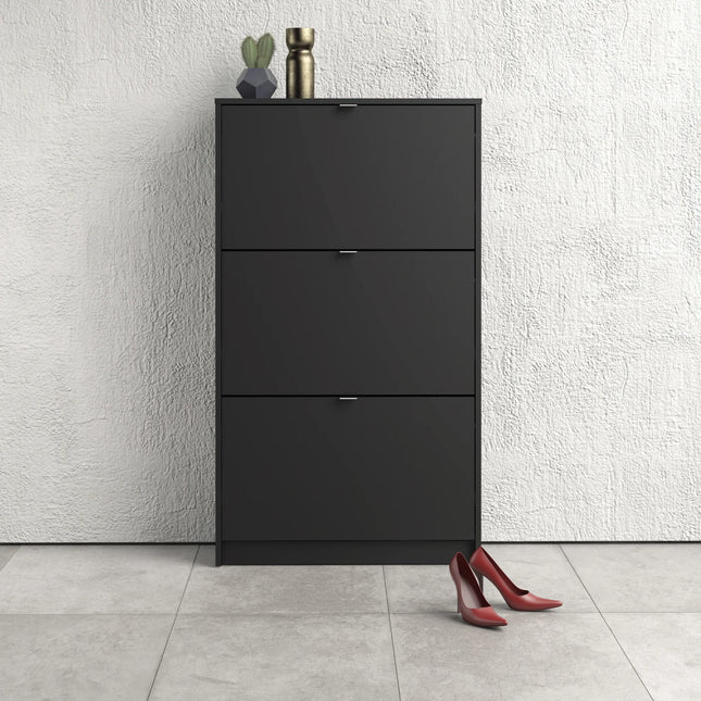 Top section of matte black three-tilt shoe cabinet with silver handles and decorative vase on top