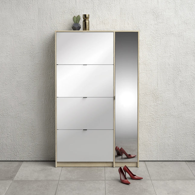 Slim mirrored side panel and three white tilt-front compartments with oak frame, red heels reflected at base