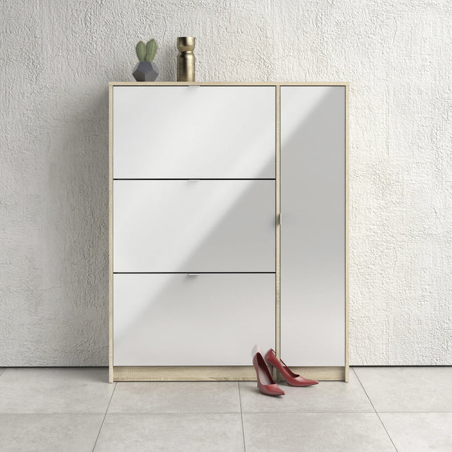 White shoe cabinet close-up with oak-effect frame, three tilting fronts and side door
