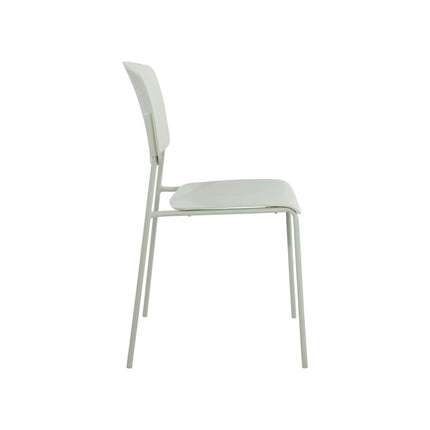 Aspen dining chair side view showing slim pale green metal legs and molded pale seat and back