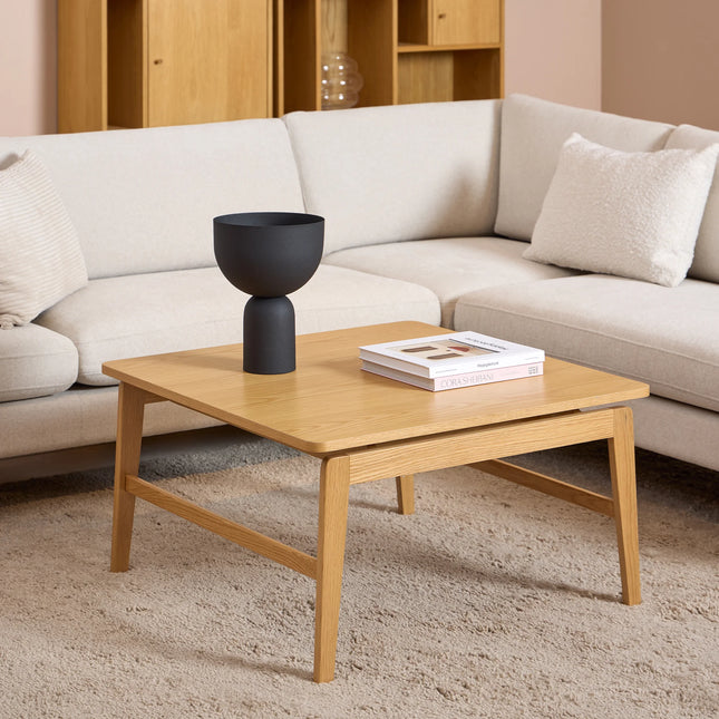 Essex Square coffee table close-up of oak veneer top and slim tapered legs