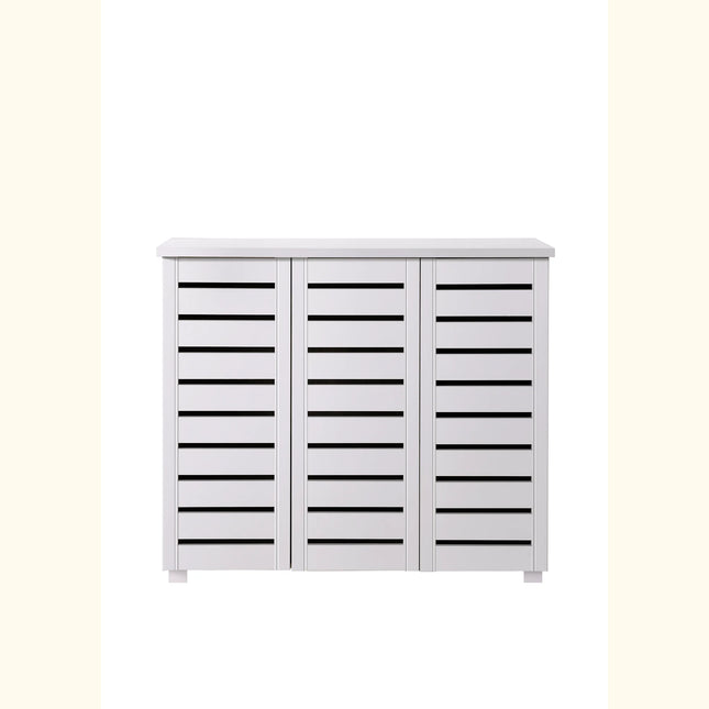 Close-up of white three-door cabinet front with horizontal slatted panels and slim plinth legs