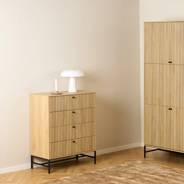 Close-up of oak-effect chest top and slatted drawer fronts with black metal legs