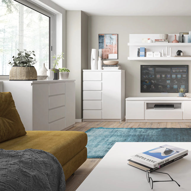 Fribo sideboard detail showing white drawer fronts and top with decorative bowl and stacked books