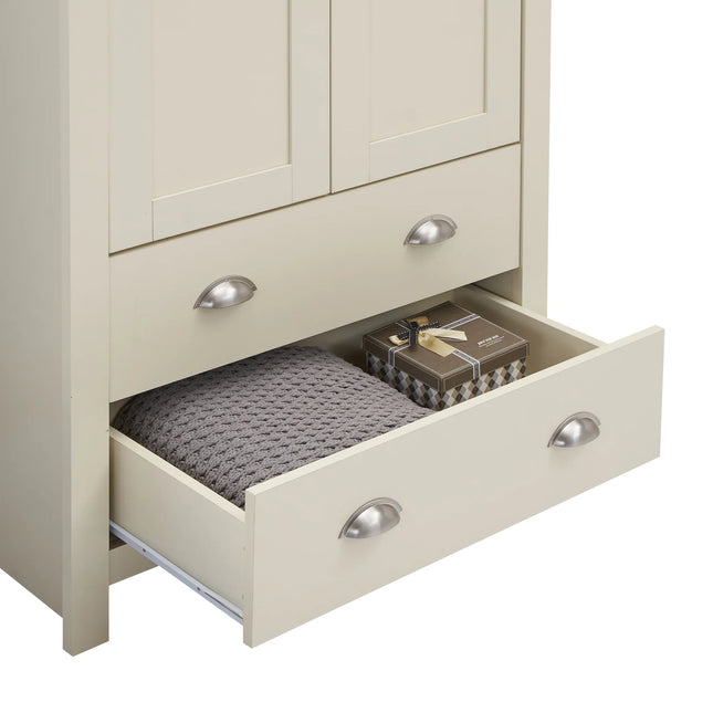 Open lower drawer with silver cup handles and soft cream painted finish