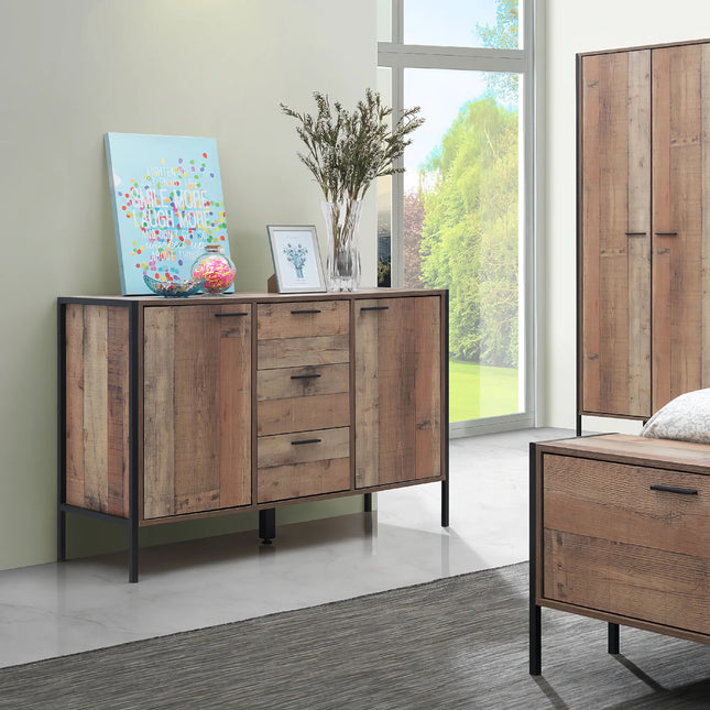 Close-up of Stretton sideboard rustic oak doors and central three-drawer stack with black metal legs