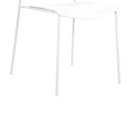 Close-up of white Aspen dining chair plastic seat and slim metal legs