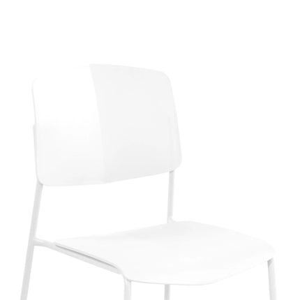 Close-up of white Aspen dining chair back and curved seat with slim metal legs